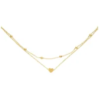 Fußkette mit goldenem Herzanhänger Goldene Fußkette mit kleinem Herzanhänger auf weißem Hintergrund