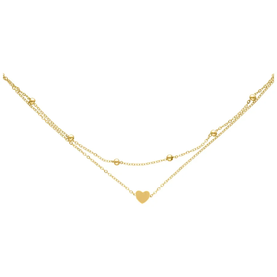 Goldene Fußkette mit kleinem Herzanhänger auf weißem Hintergrund