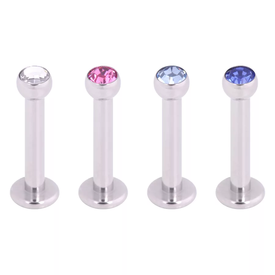 Labret mit Kristall in Silber und Blau Vier silberne Labrets mit klaren, pinken und blauen Kristallen auf weißem Hintergrund