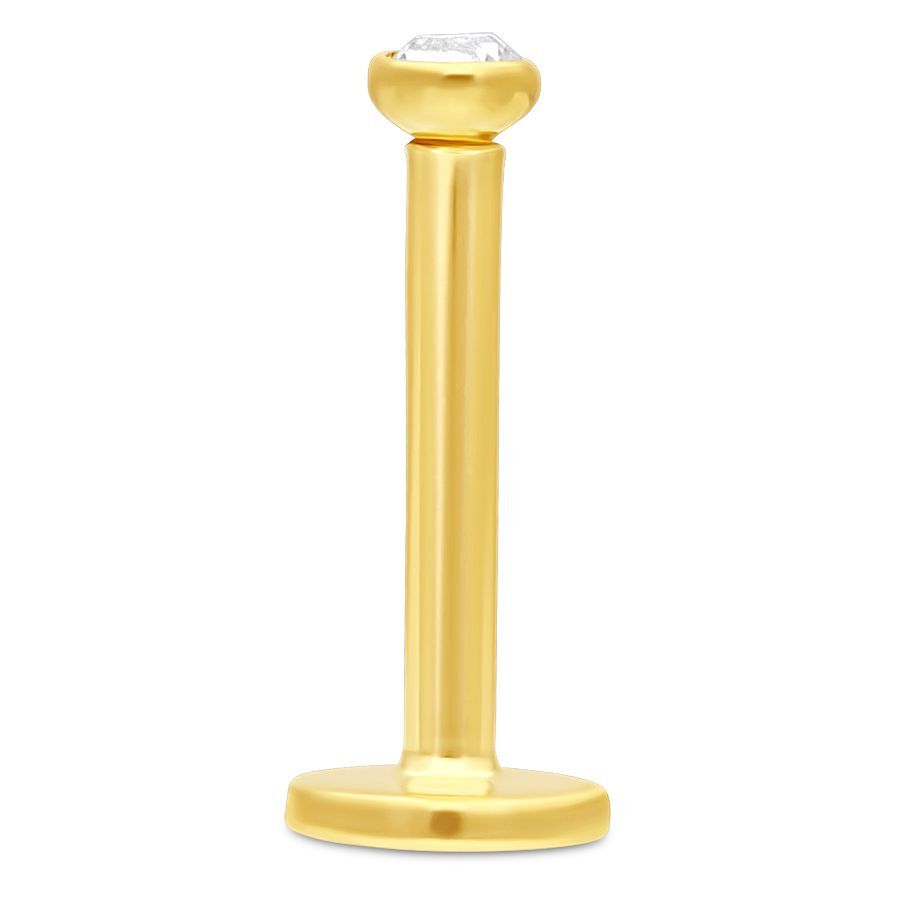 18K Gold Labret mit Kristall Goldenes 18K Labret mit klarem Kristall auf weißem Hintergrund
