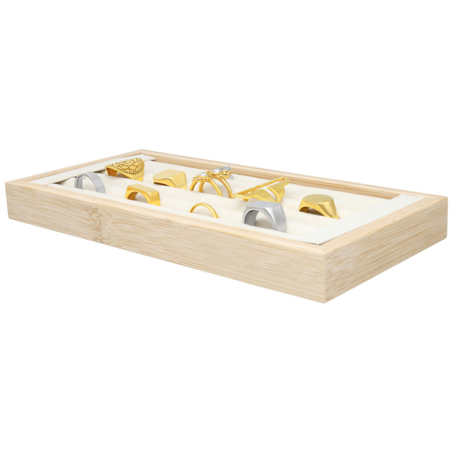 Rechteckiger Ring Display aus Holz mit schwarzen Ringen auf beigem Hintergrund