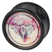 Schwarzer Plug mit Diamant-Design Runder schwarzer Plug mit rosa Diamantmotiv auf weißem Hintergrund