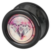 Schwarzer Plug mit Diamantdesign in Pink Schwarzer Plug aus PMMA mit pinkem Diamantdesign auf weißem Hintergrund