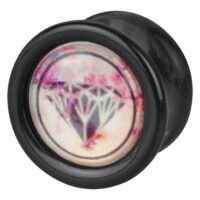 Schwarzer Plug mit Diamantdesign Schwarzer Plug aus PMMA mit rosa Diamantmotiv auf hellem Hintergrund