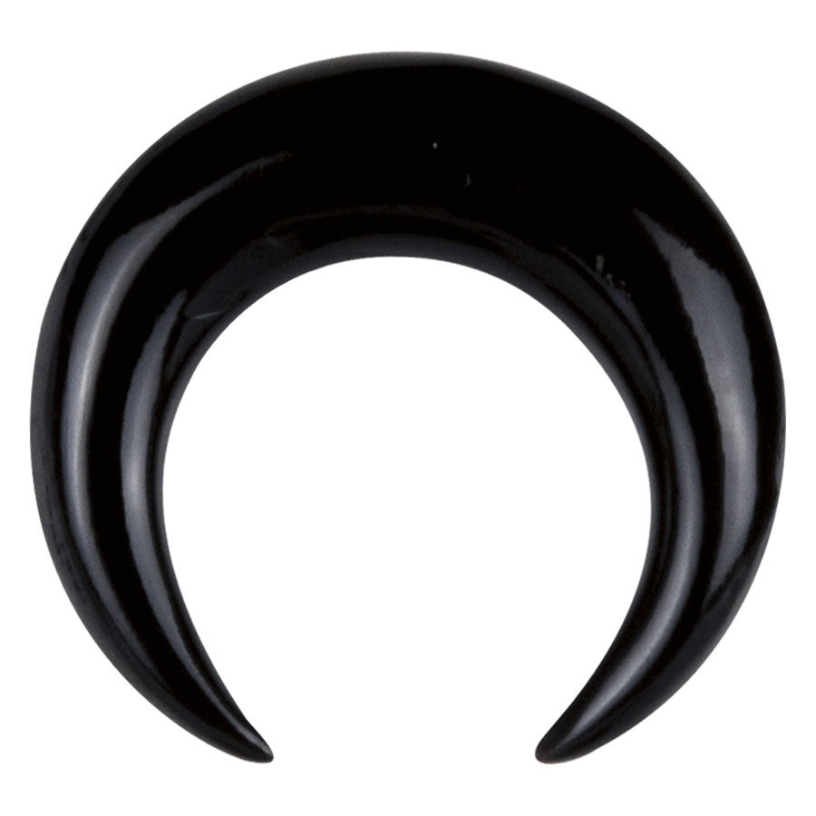 Schwarze Dehnsichel aus Horn Schwarze Dehnsichel aus Horn auf weißem Hintergrund