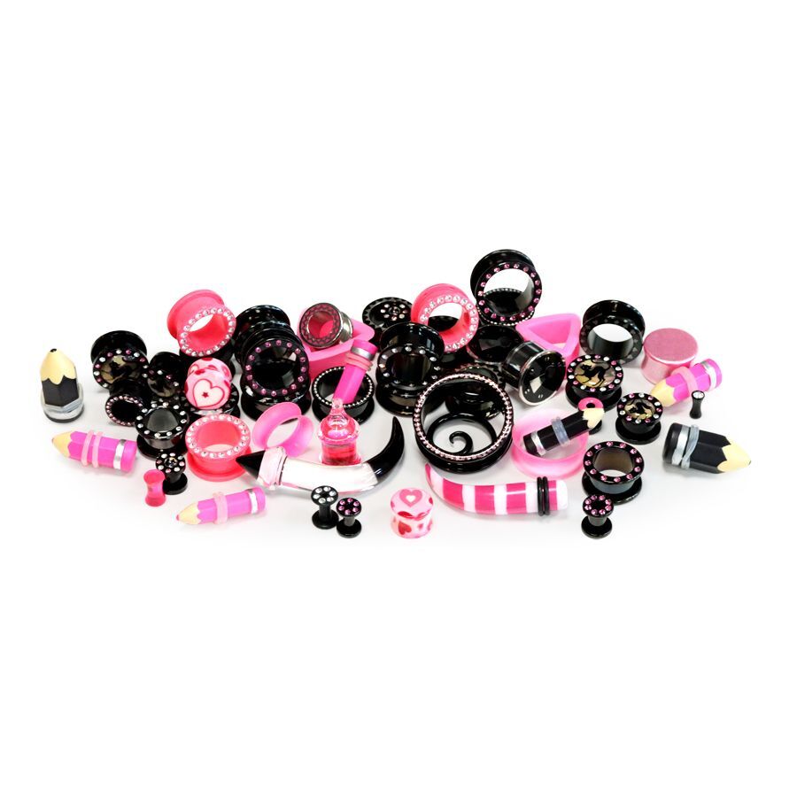 Pink-Schwarzes Piercing-Set von Wildcat Verschiedene pink-schwarze Piercings auf weißem Hintergrund