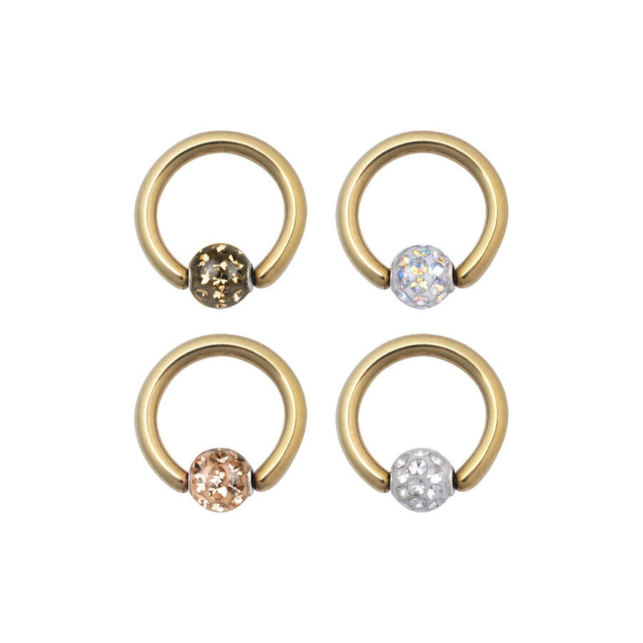 Goldene Clip in Ringe mit Kristallen Vier goldene Clip in Ringe mit verschiedenfarbigen Kristallen auf weißem Hintergrund