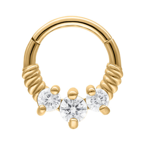Goldener Septum Clicker mit drei klaren Kristallen auf weißem Hintergrund