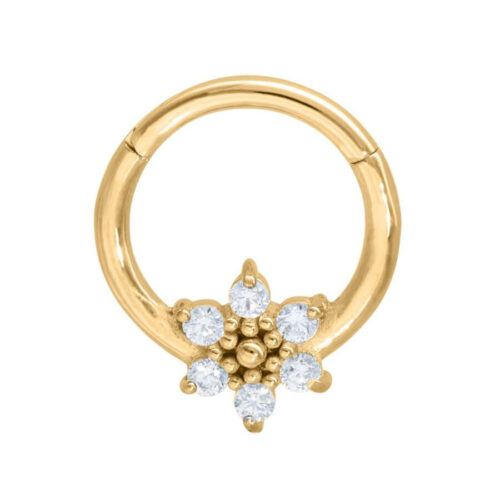 Goldener Clicker-Piercing mit Eiskristall-Design auf weißem Hintergrund