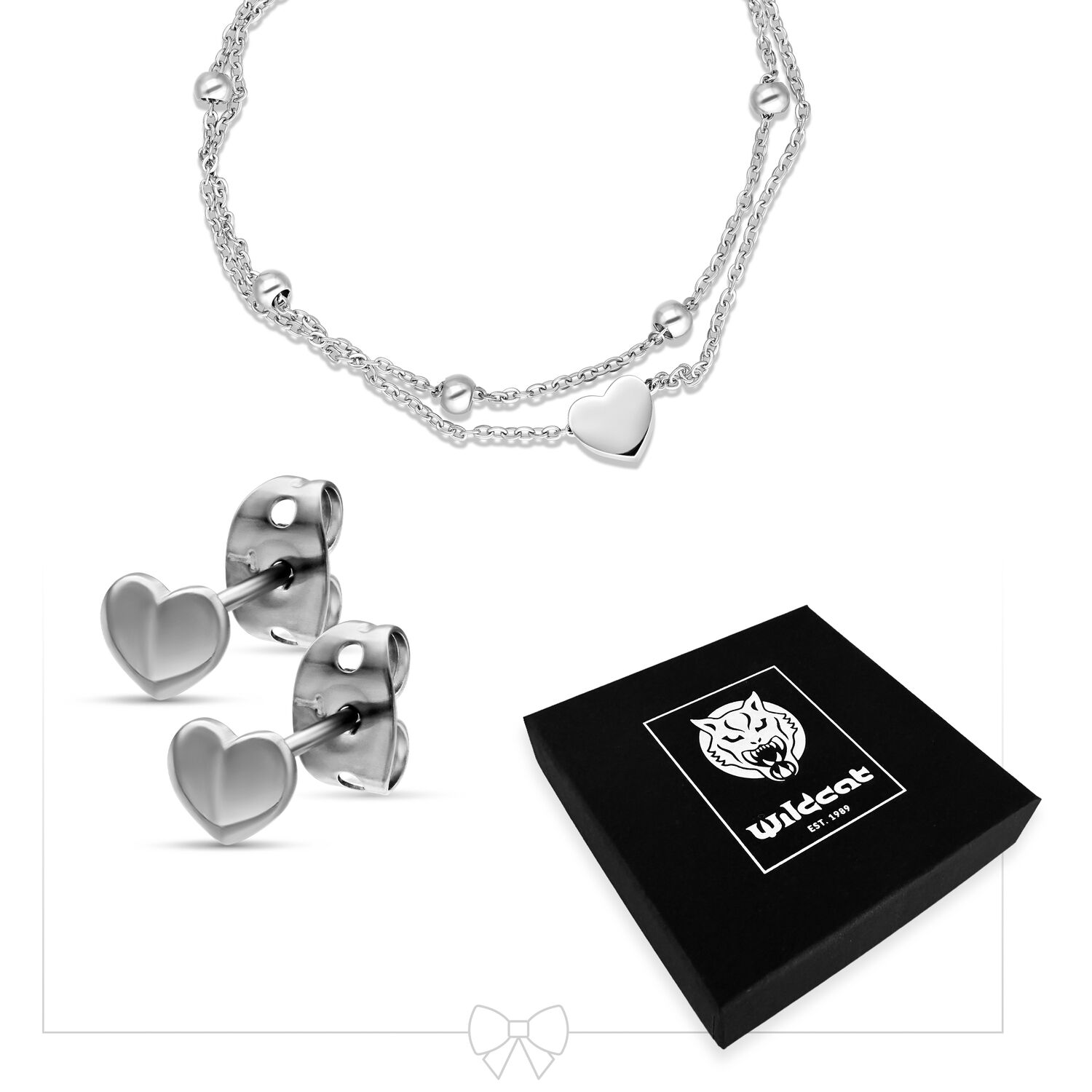 Herzarmband und Ohrringe Set aus Edelstahl Silbernes Herzarmband mit doppelter Kette und Herzohrringe neben schwarzer Geschenkbox